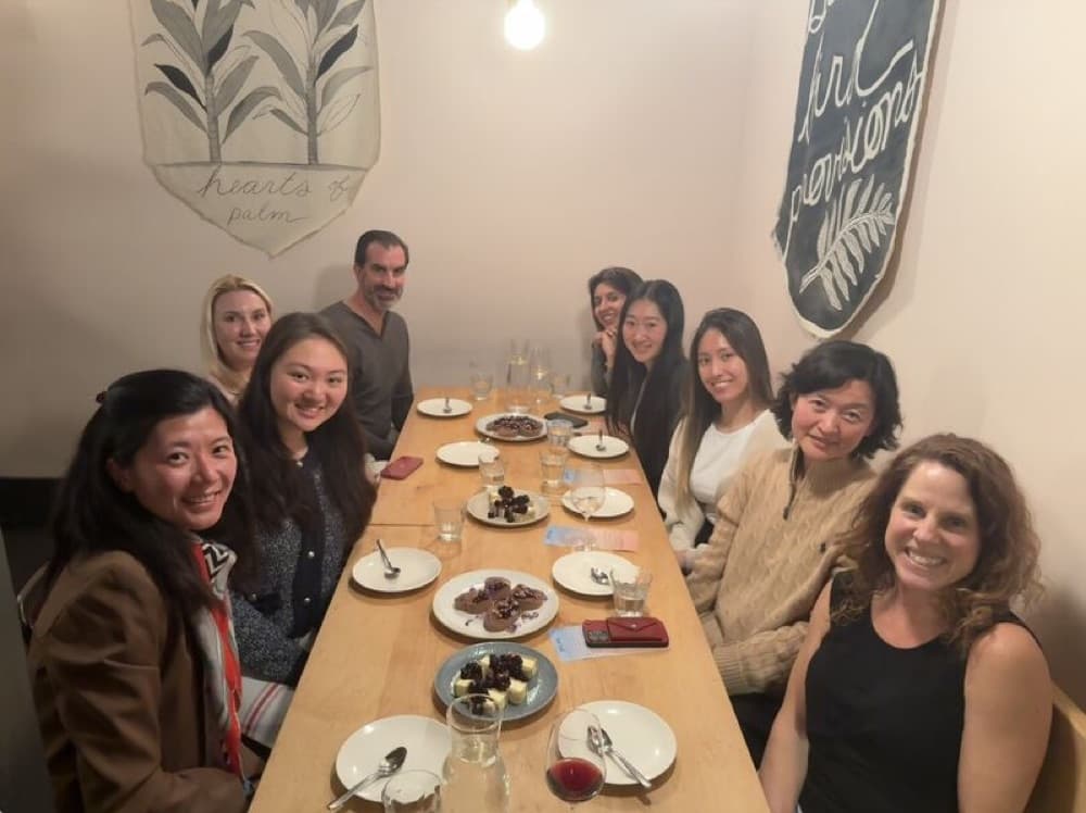 Oxus dinner around a long wooden table
